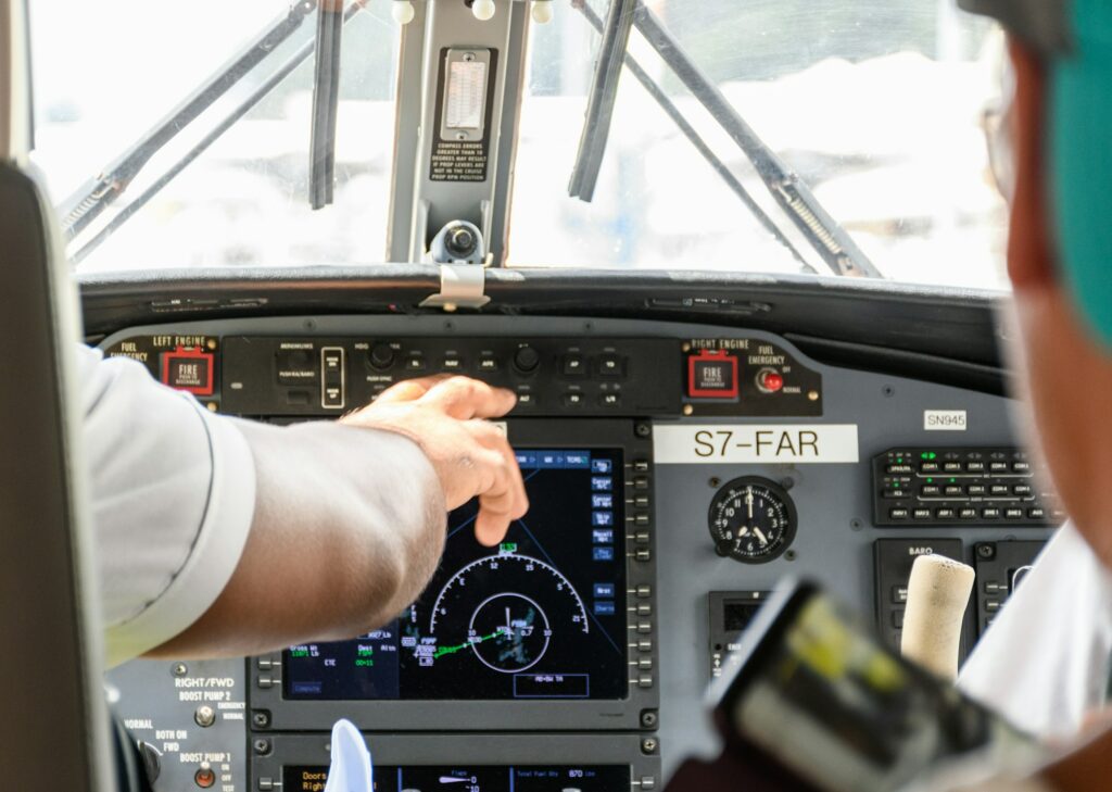 Close-up of aircraft cockpit, passenger jet, dash, navigation, screen radar, airplane.