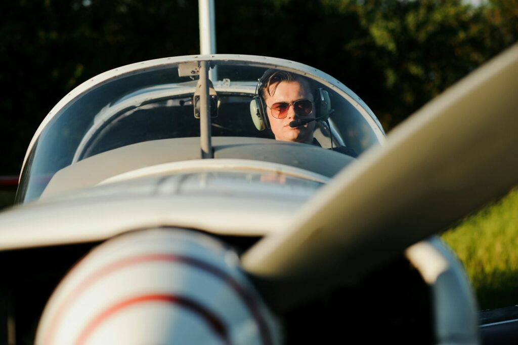 Young pilot is preparing for take off with private plane.