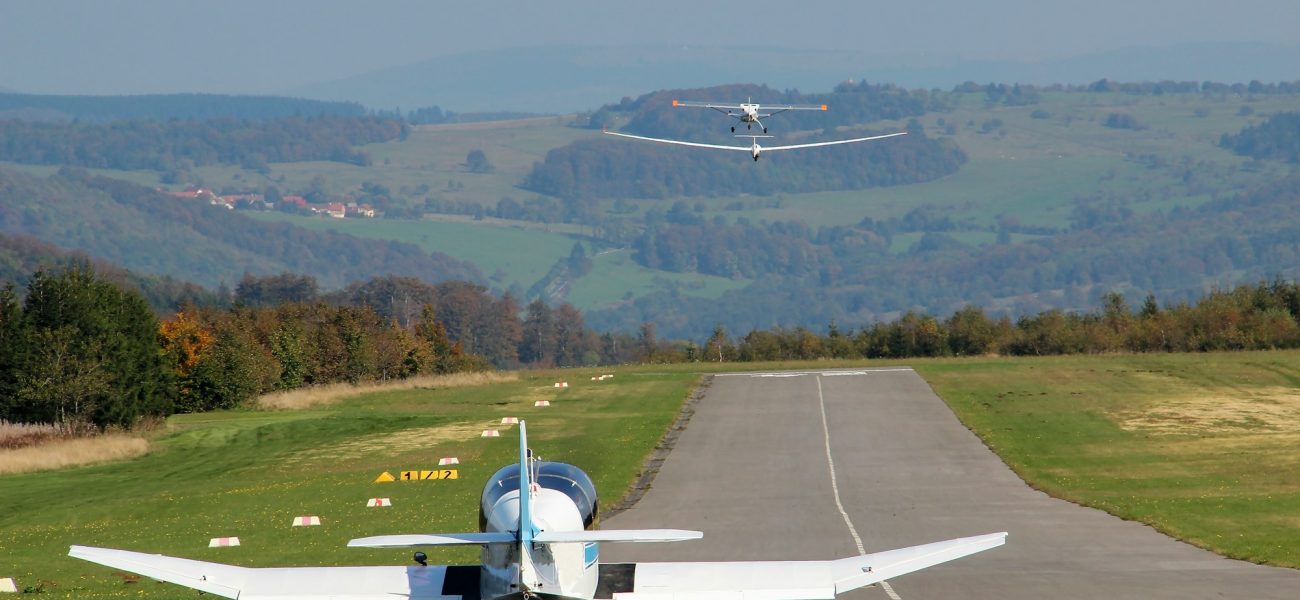 Small aircraft with mountains on the background